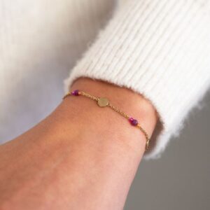 Armband met munt paarse kralen GOUD